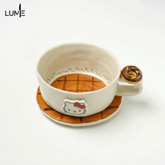 KT coffee cups and saucers