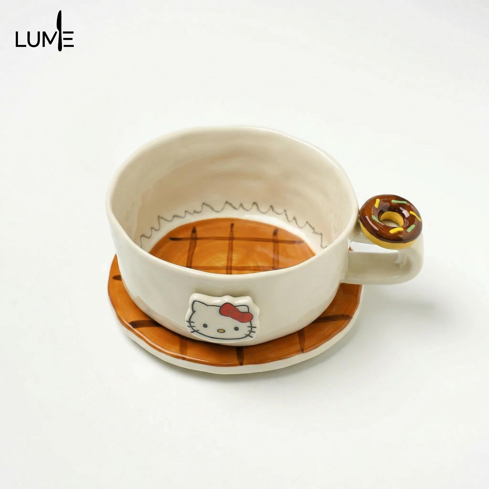 KT coffee cups and saucers